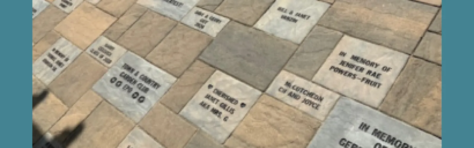 Memorial bricks located at the library's Dryden Green Space