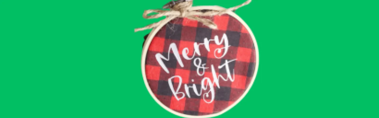 Christmas ornament made with plaid material, an embroidery hoop, and the words "Merry and Bright"