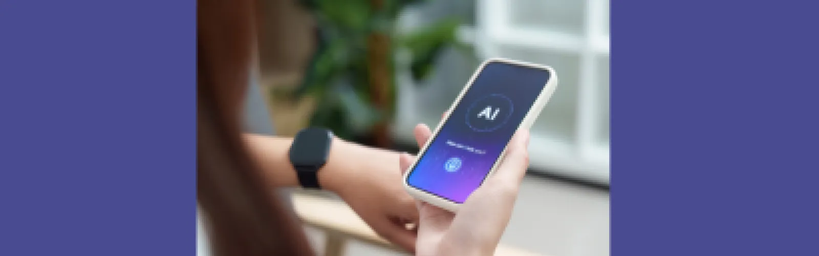 A hand holding a phone with the letters AI on the screen