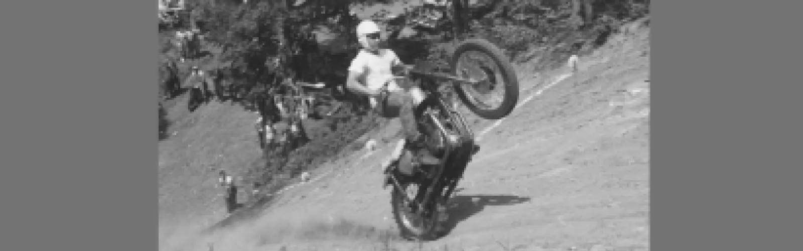Motorcycle rider riding a motorcycle up a hill