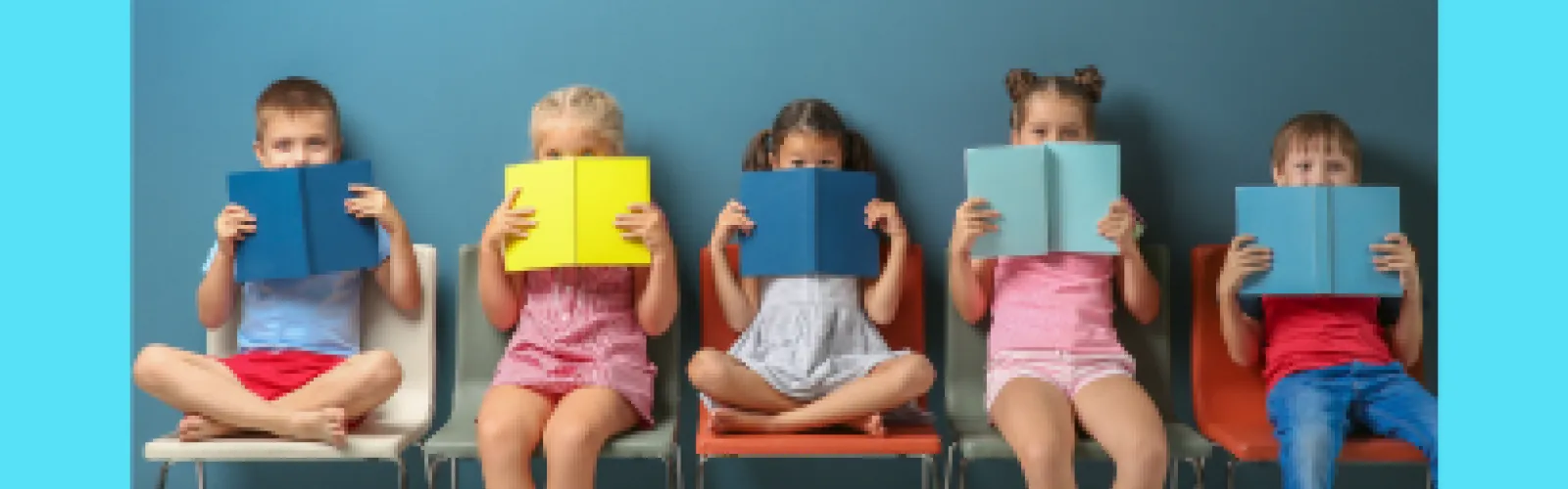 Five children sitting on a bench with a book in front of their face