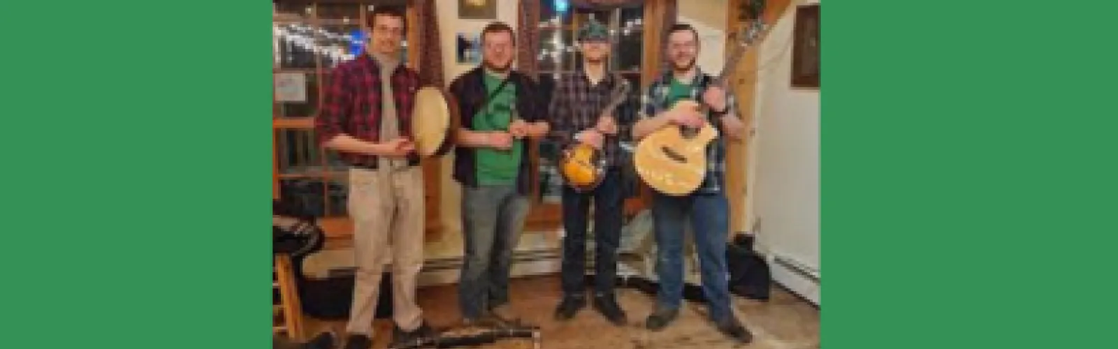 Four members of the Irish Brigadiers holding musical instruments on green background